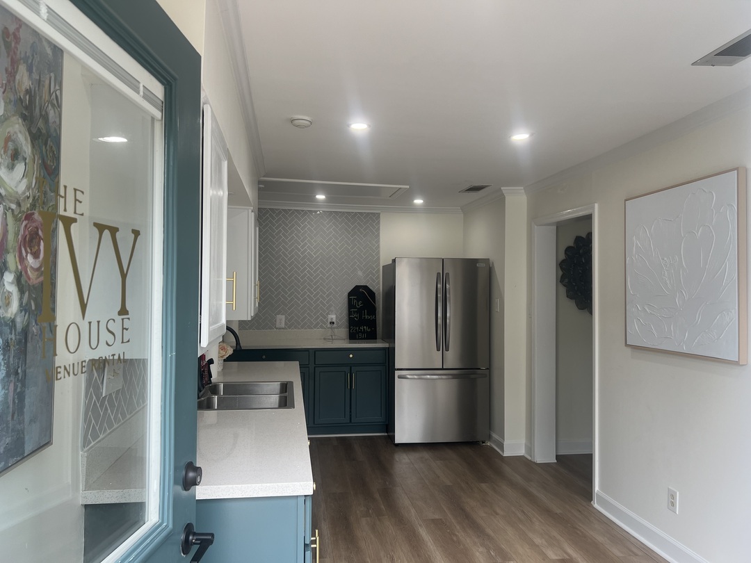 Kitchenette and prep area with The Ivy House etched glass door